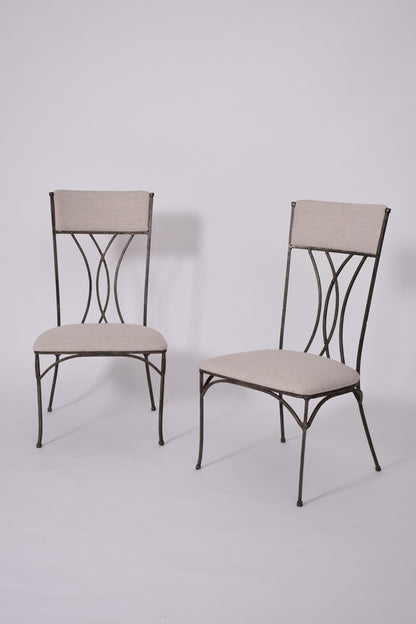 Pair of neoclassical iron chairs, 1960s.