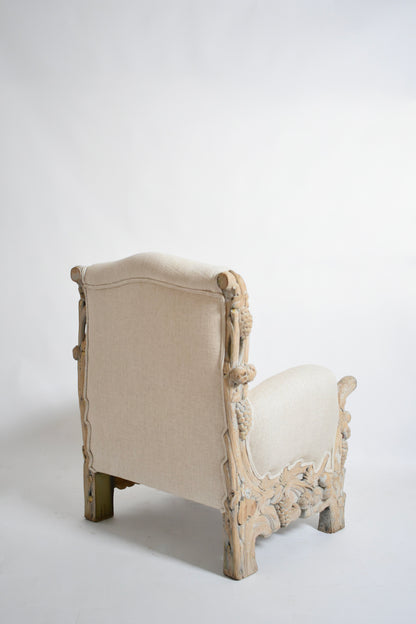 Carved limed oak fruits and foliage armchair, 1970s.