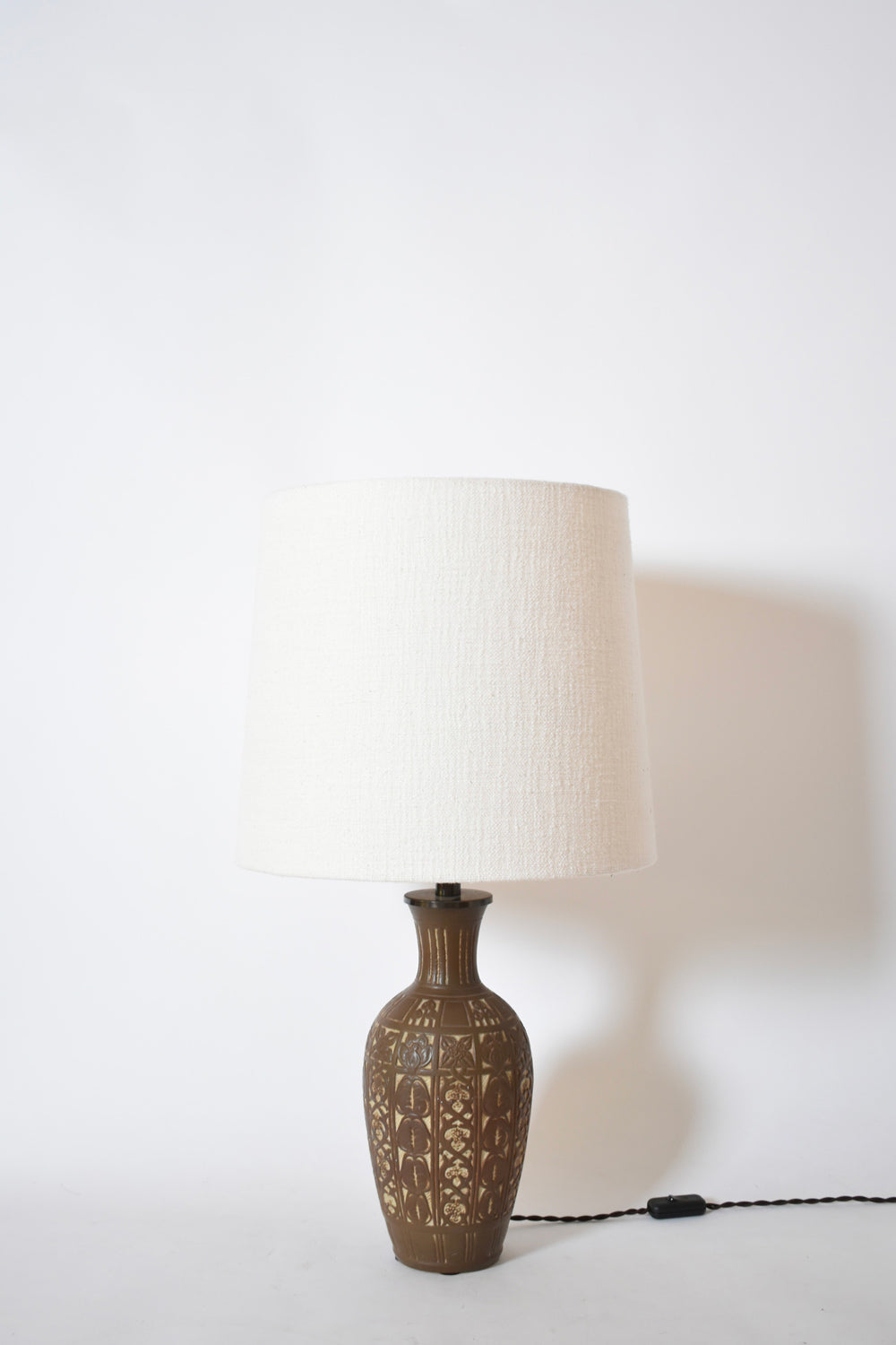 Low relief folliage pattern ceramic lamp, 1930s.