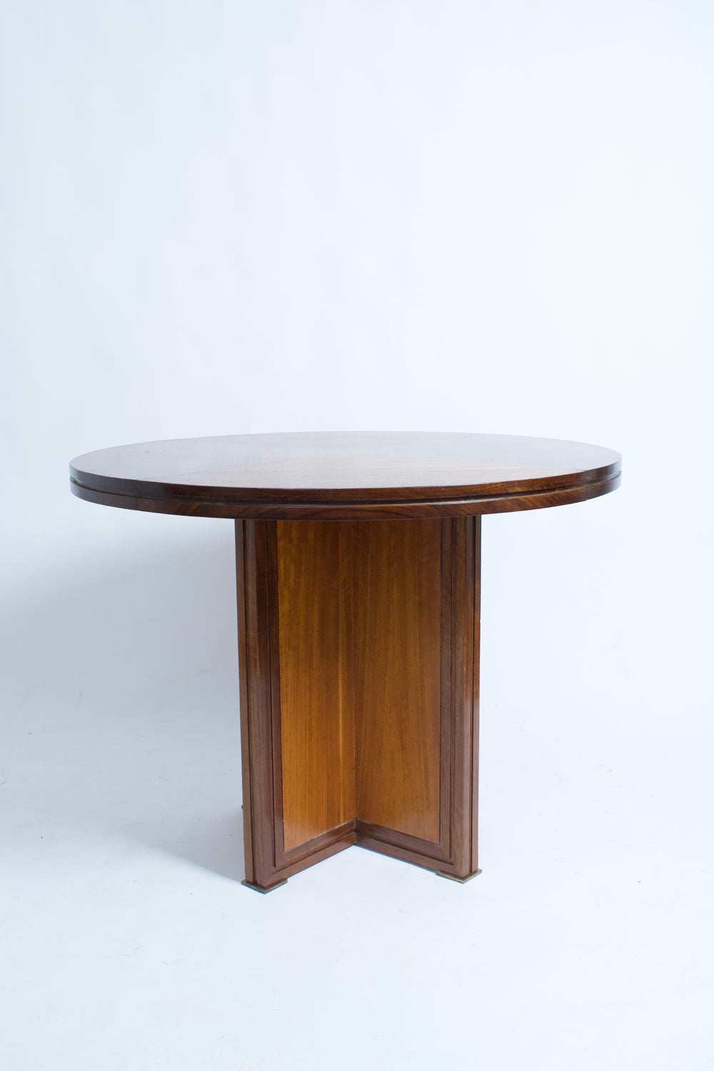 Round wooden table with a cross foot, 1940s.