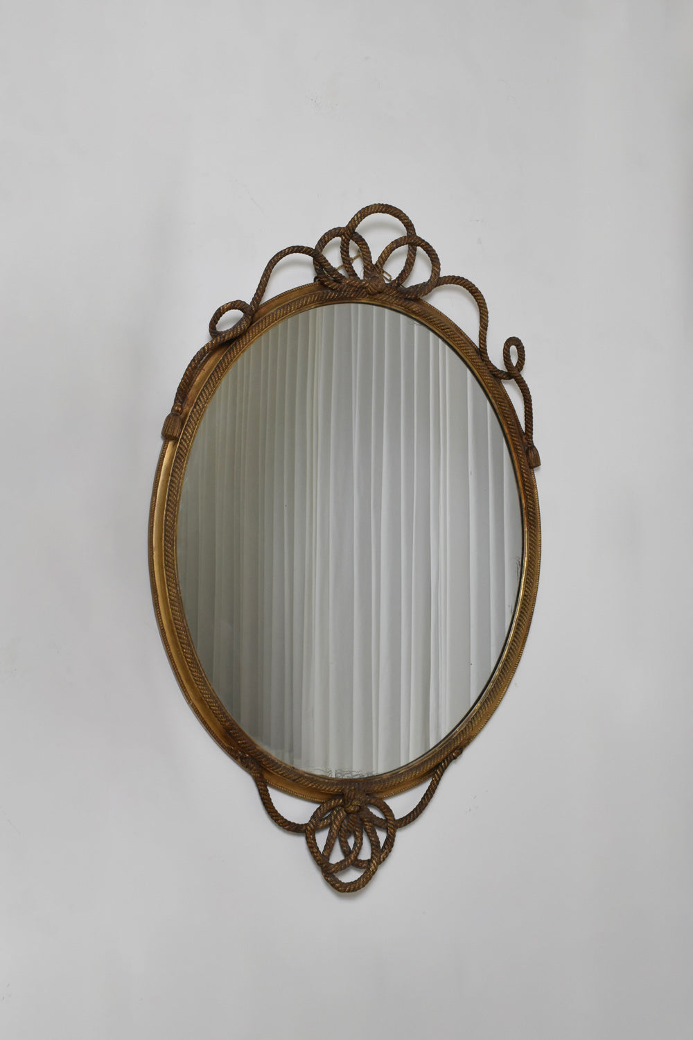 Important oval trimmings and pompoms mirror, XIXth c.