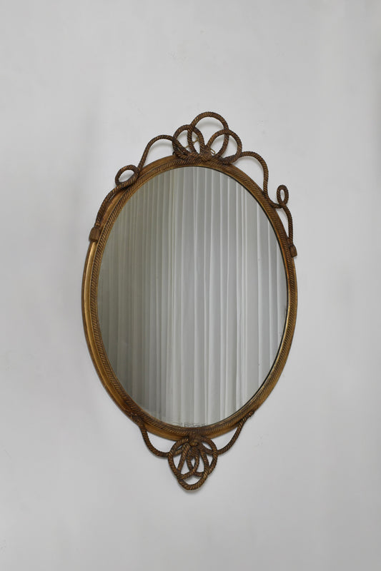 Important oval trimmings and pompoms mirror, XIXth c.
