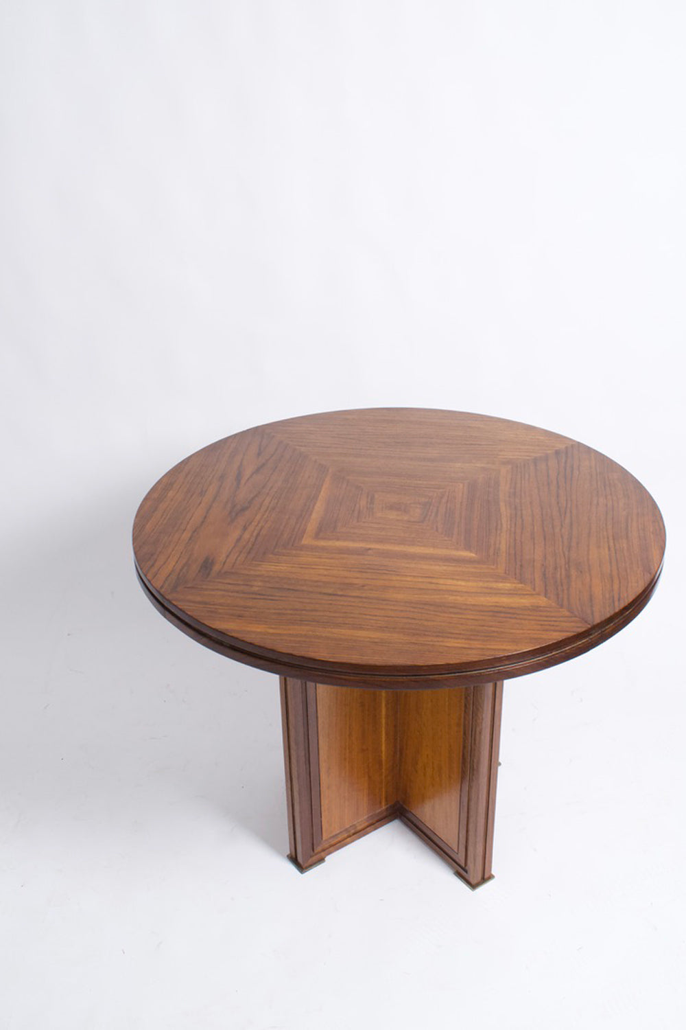 Round wooden table with a cross foot, 1940s.