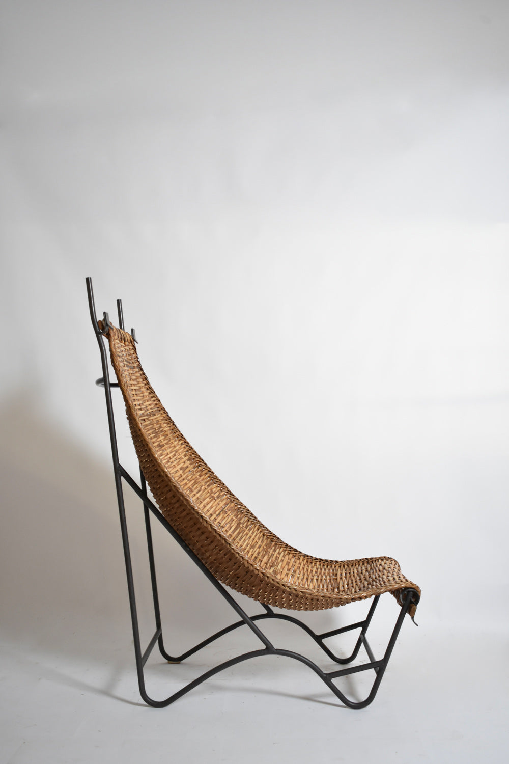 Wrought iron and rattan armchair, 1950s.