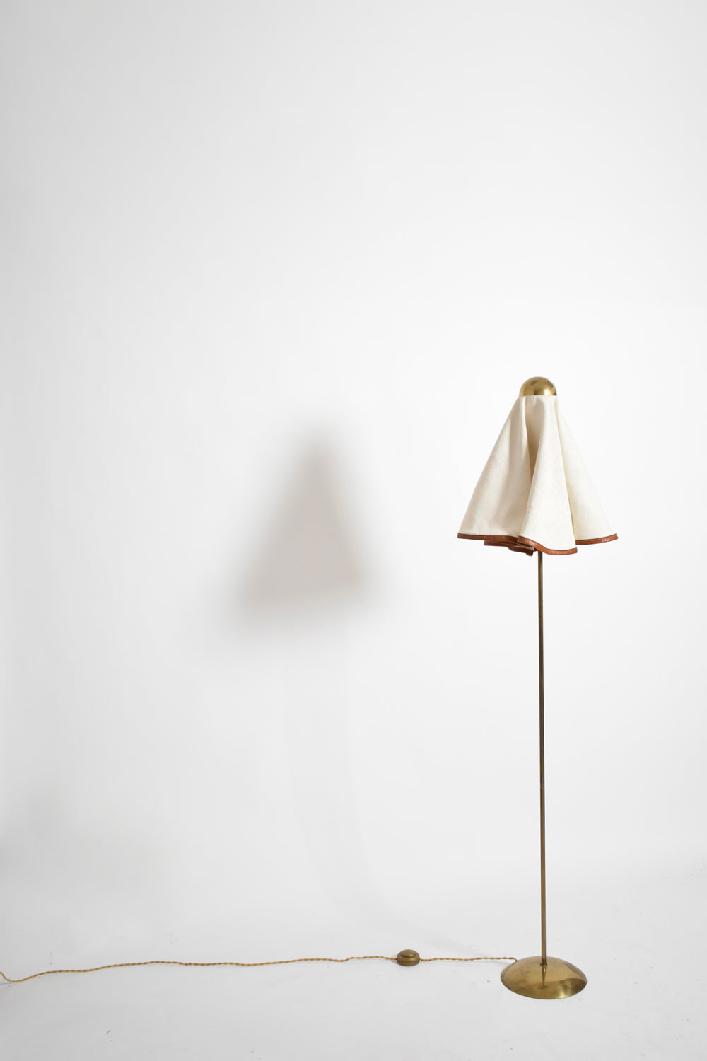 Brass, fabric and leather floor lamp, 1960s.