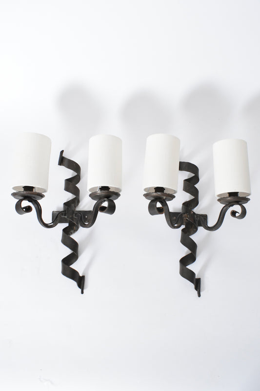 Pair of ribbon wrought iron wall sconces, 1950s.