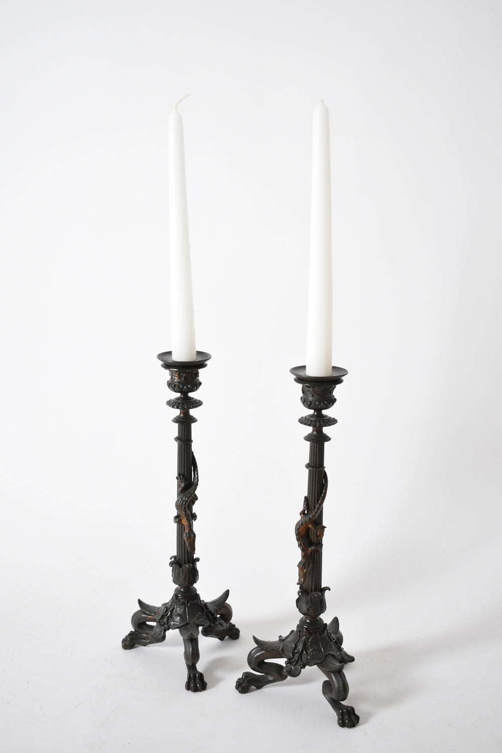 Set of four tripod zoomorphic bronze candleholders, XIXth c.