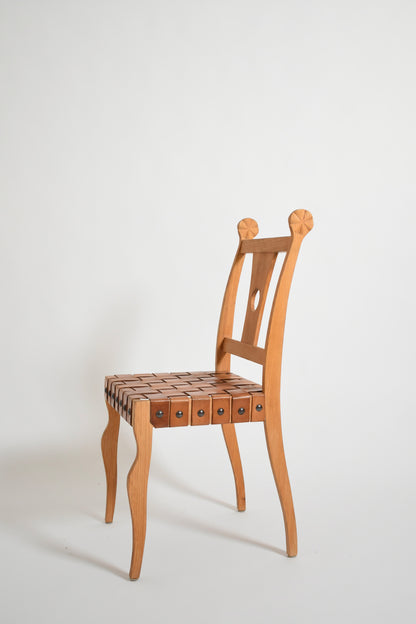 Pair of etruscan oak and leather chairs, 1970s.