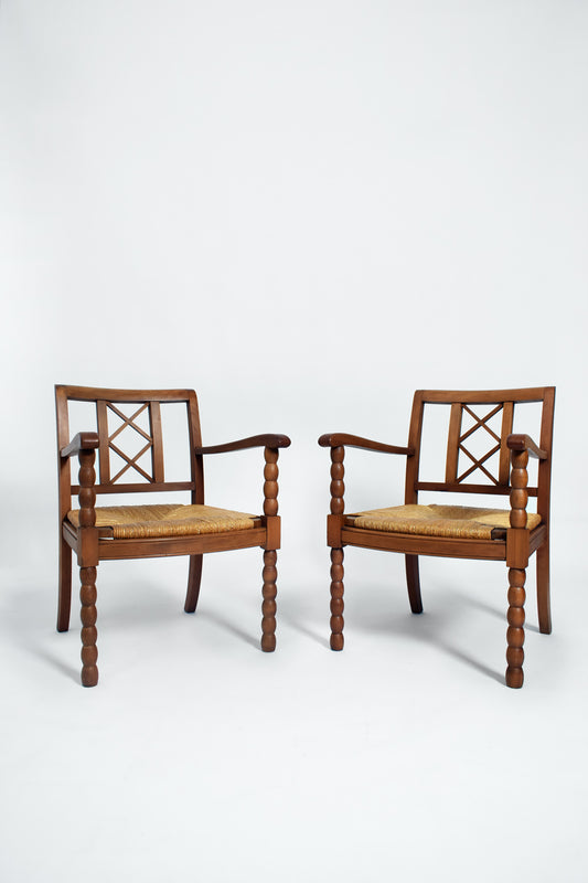 Pair of straw and wood armchairs, 1950s.