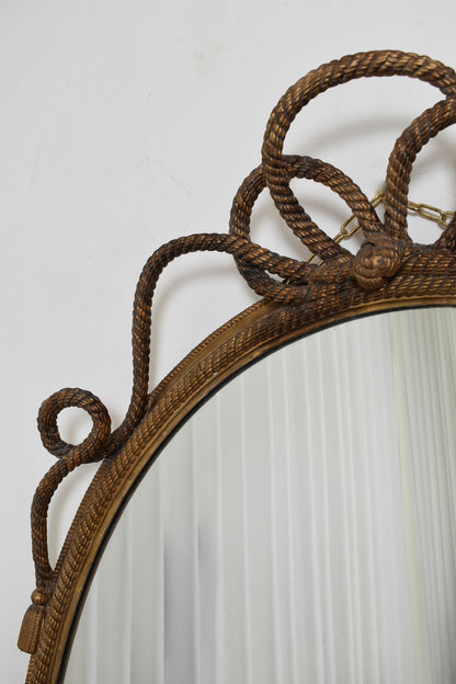 Important oval trimmings and pompoms mirror, XIXth c.