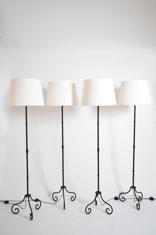Set of four wrought iron floor lamps, 1960s.