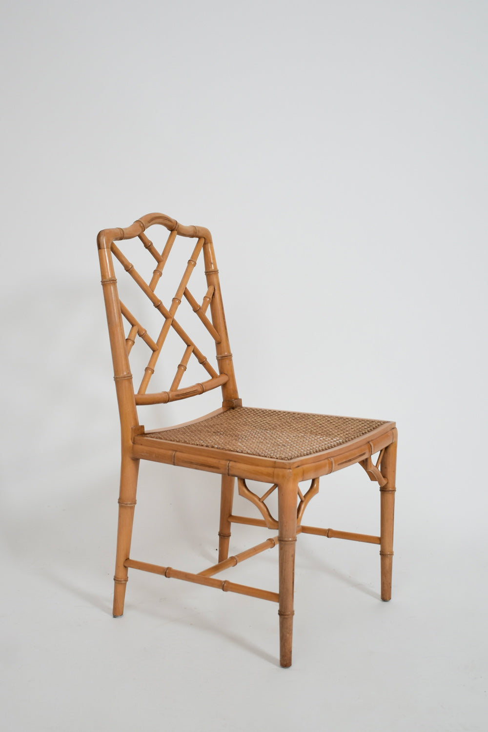 Pair of faux bamboo and canning chairs, 1970s.