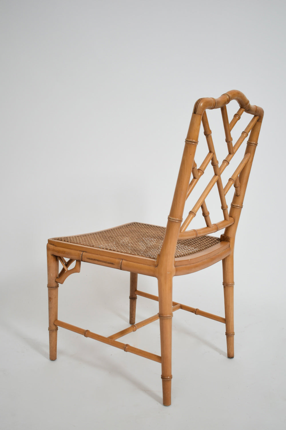 Pair of faux bamboo and canning chairs, 1970s.