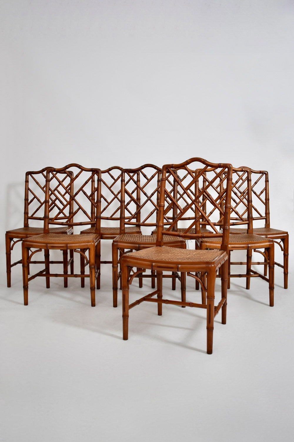 Set of 8 faux bamboo and canning chairs, 1970s.