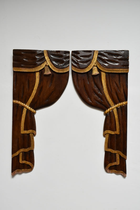 Pair of low relief wooden sculptered and gilded curtains, 1920s.