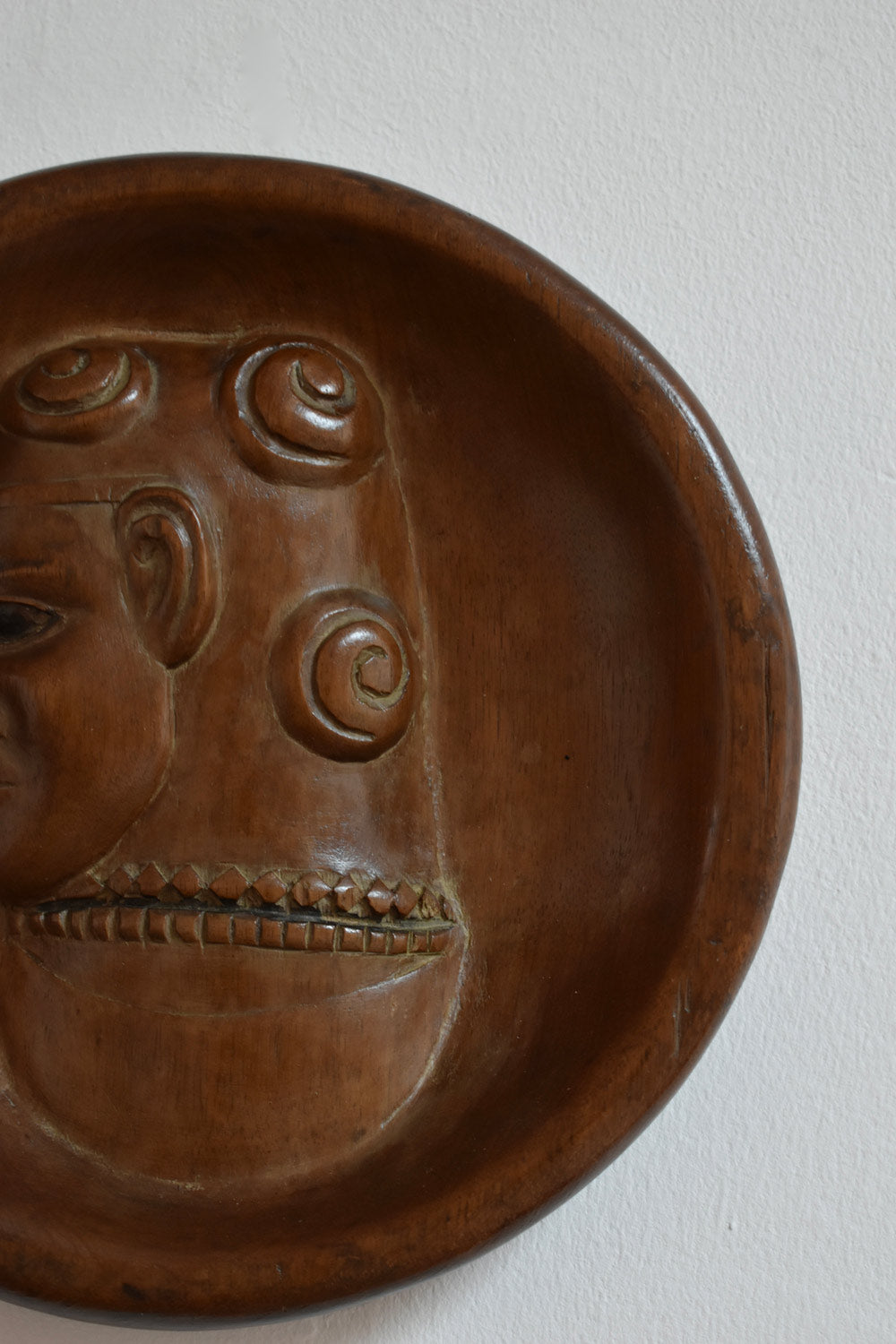 Africanist low relief round wooden wall sculpture, 1970s.