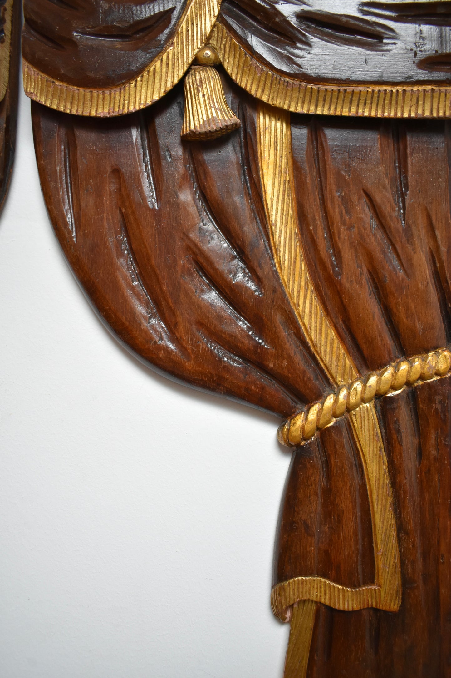 Pair of low relief wooden sculptered and gilded curtains, 1920s.