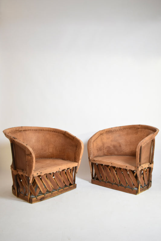 Pair of large wood and leather mexican armchairs, 1970s.