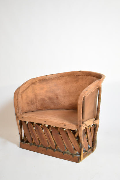 Pair of large wood and leather mexican armchairs, 1970s.