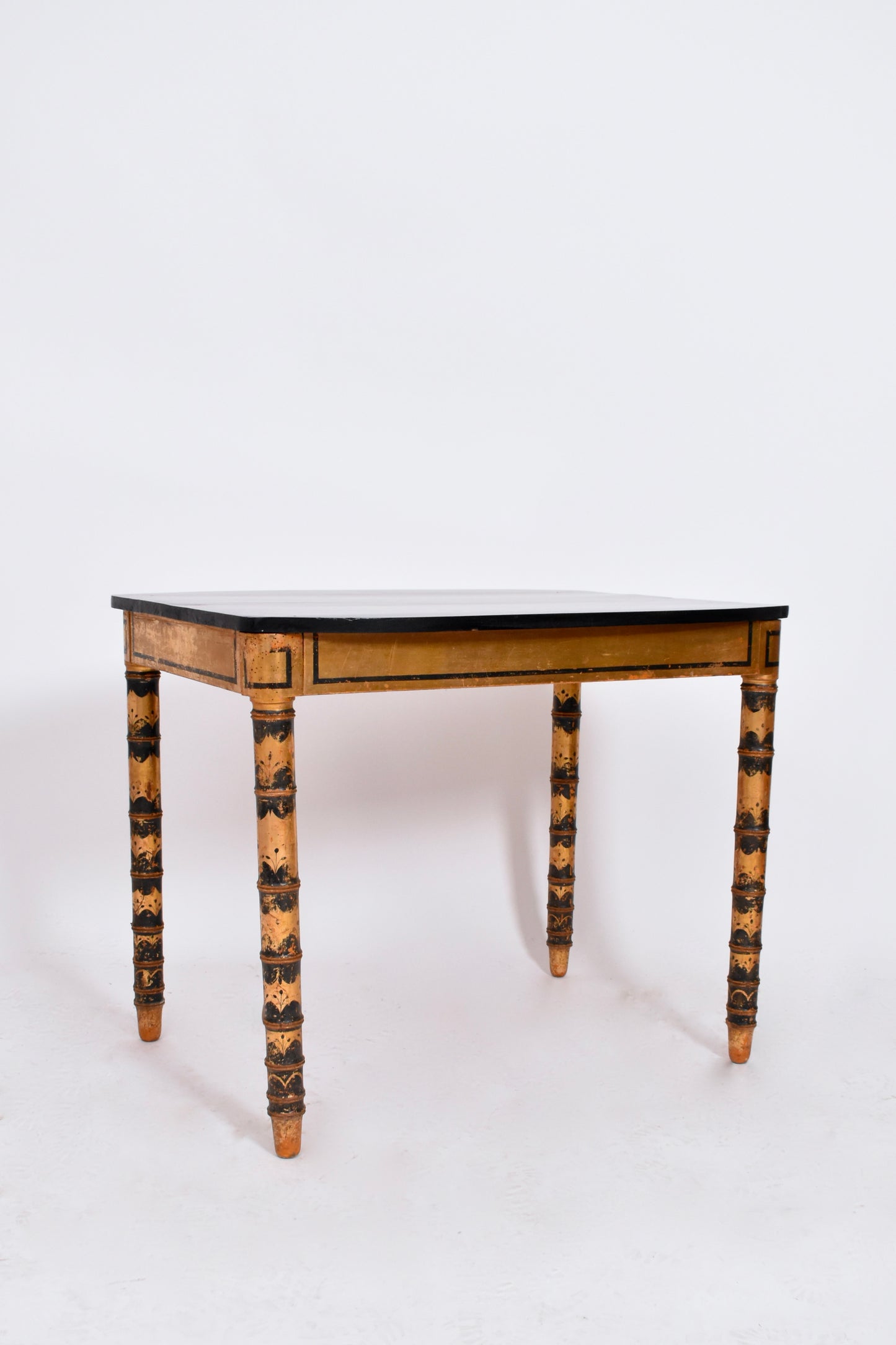 Ebonised and gold painted table, 1920s.