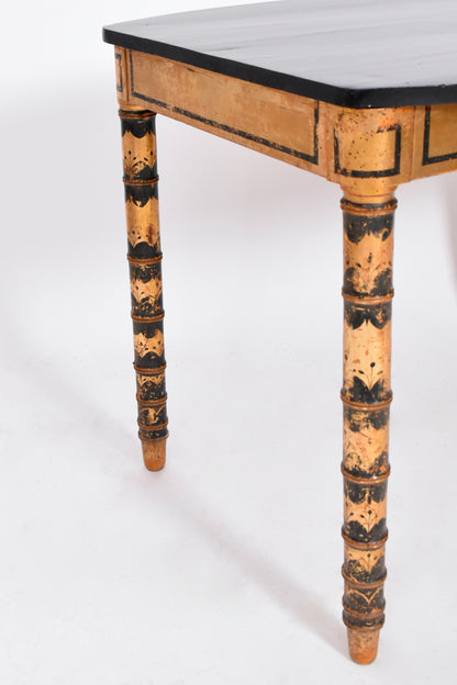 Ebonised and gold painted table, 1920s.