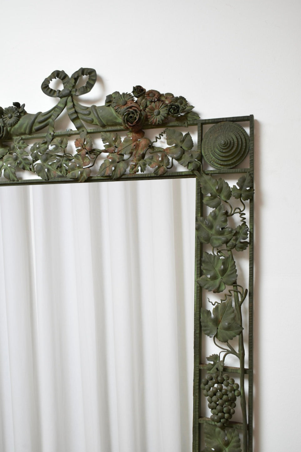 Large floral wrought iron mirror, XIXth c.