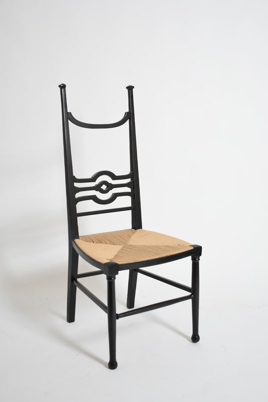 Arts & Crafts ebonised wood fireside chair, 1900s.
