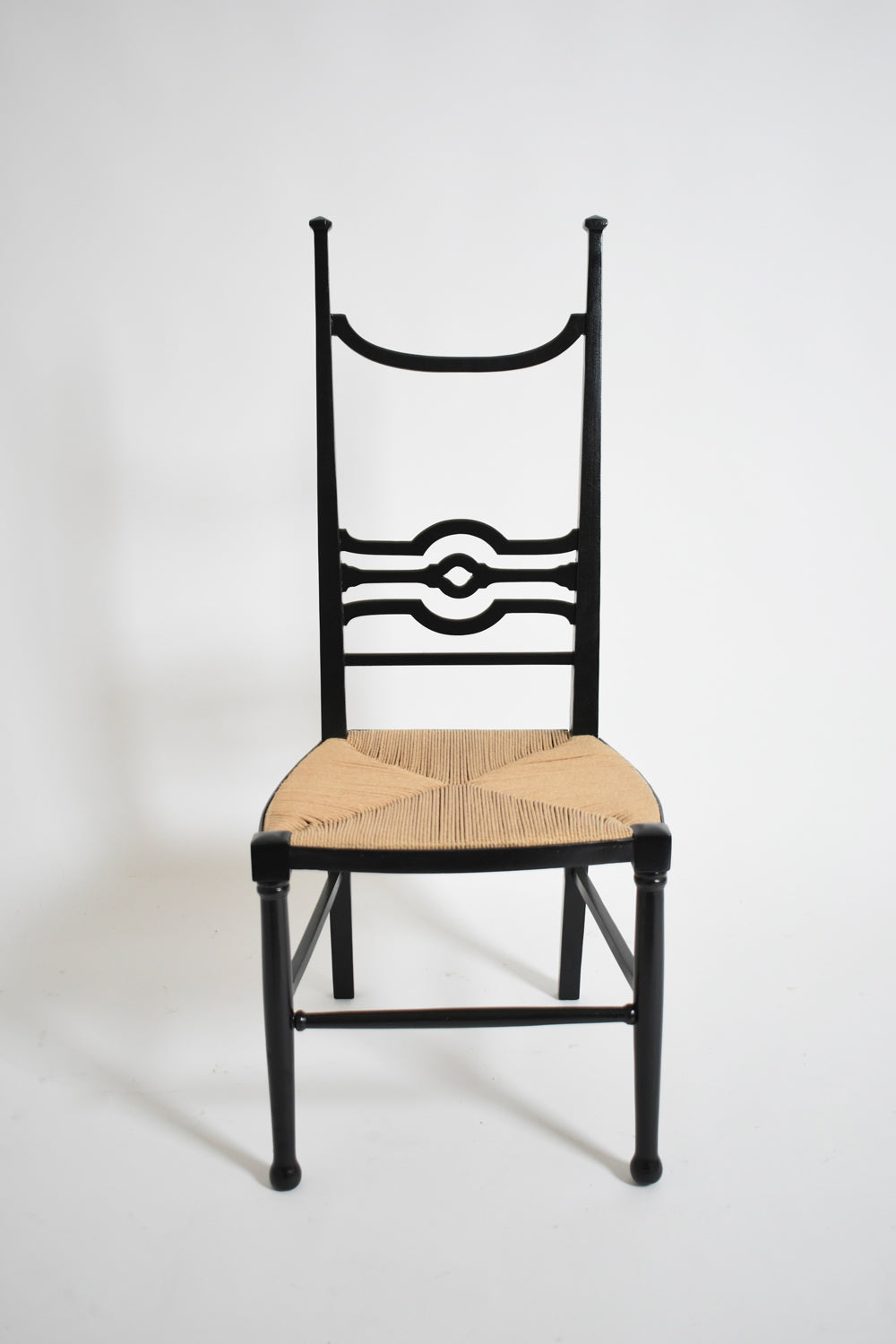 Arts & Crafts ebonised wood fireside chair, 1900s.