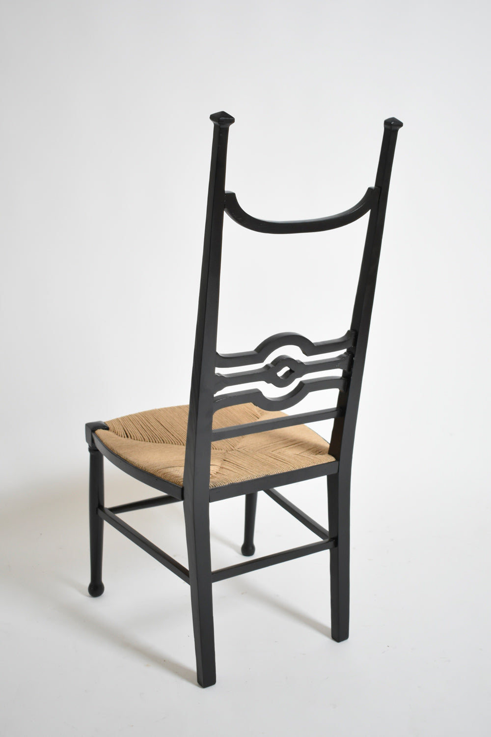 Arts & Crafts ebonised wood fireside chair, 1900s.