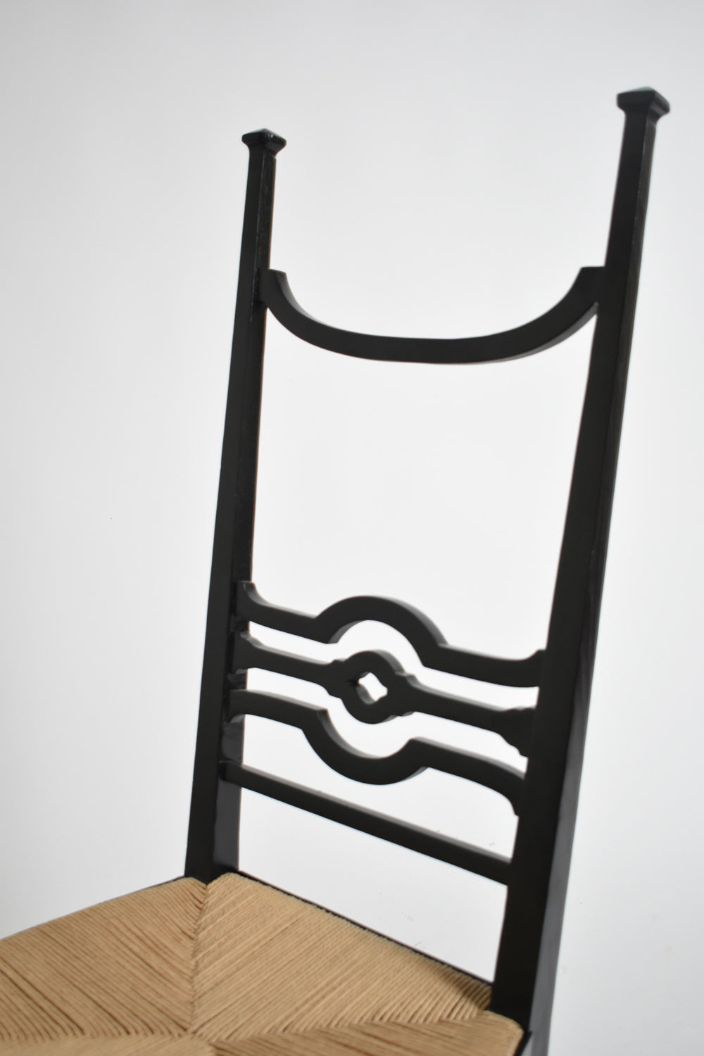 Arts & Crafts ebonised wood fireside chair, 1900s.