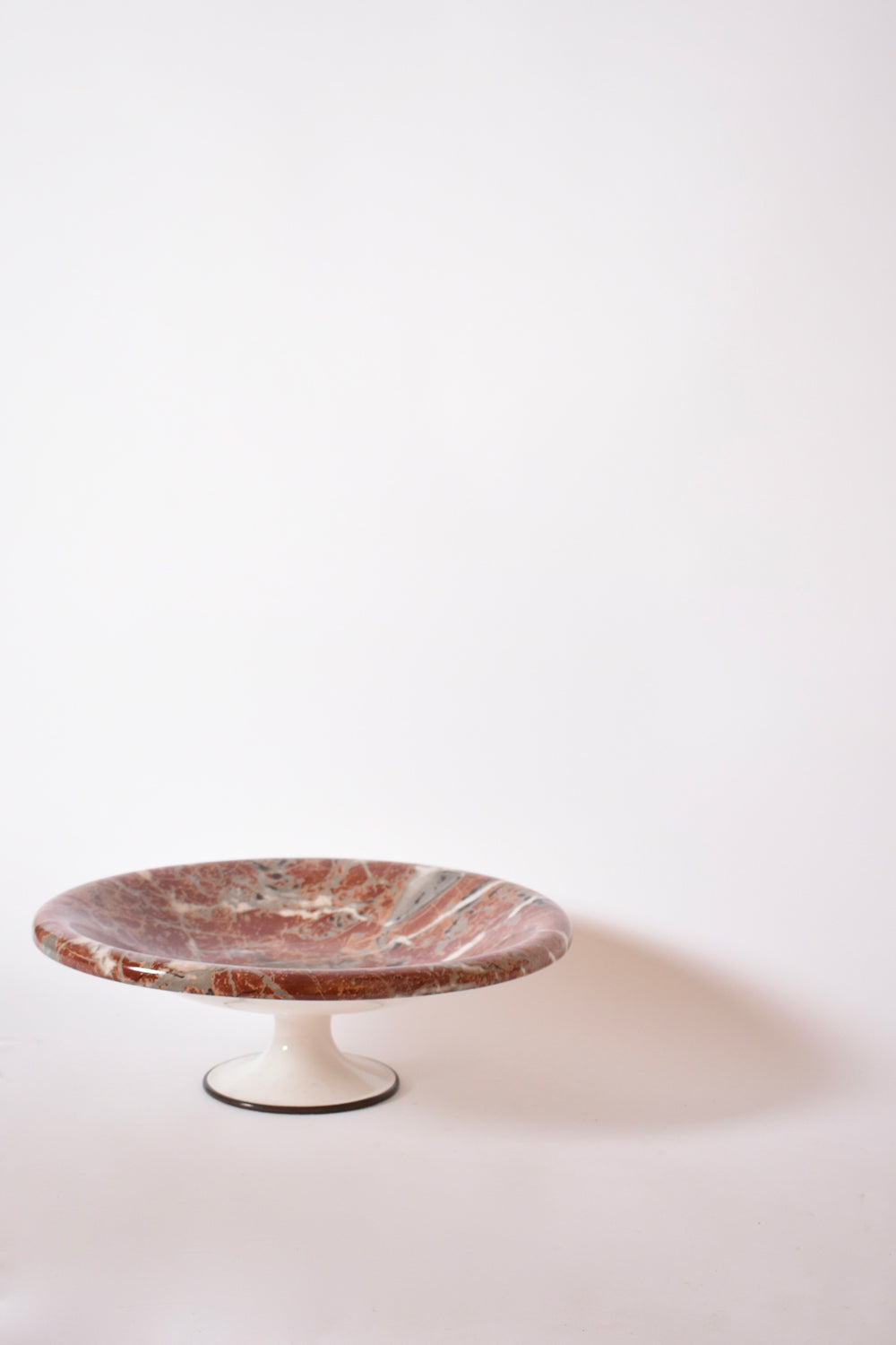 Neoclassical faux marble plate on pedestal, 1960s.