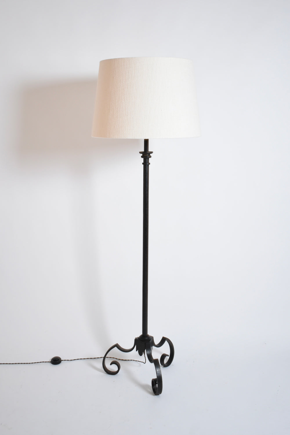 Tripod wrought iron floor lamp, 1950s.