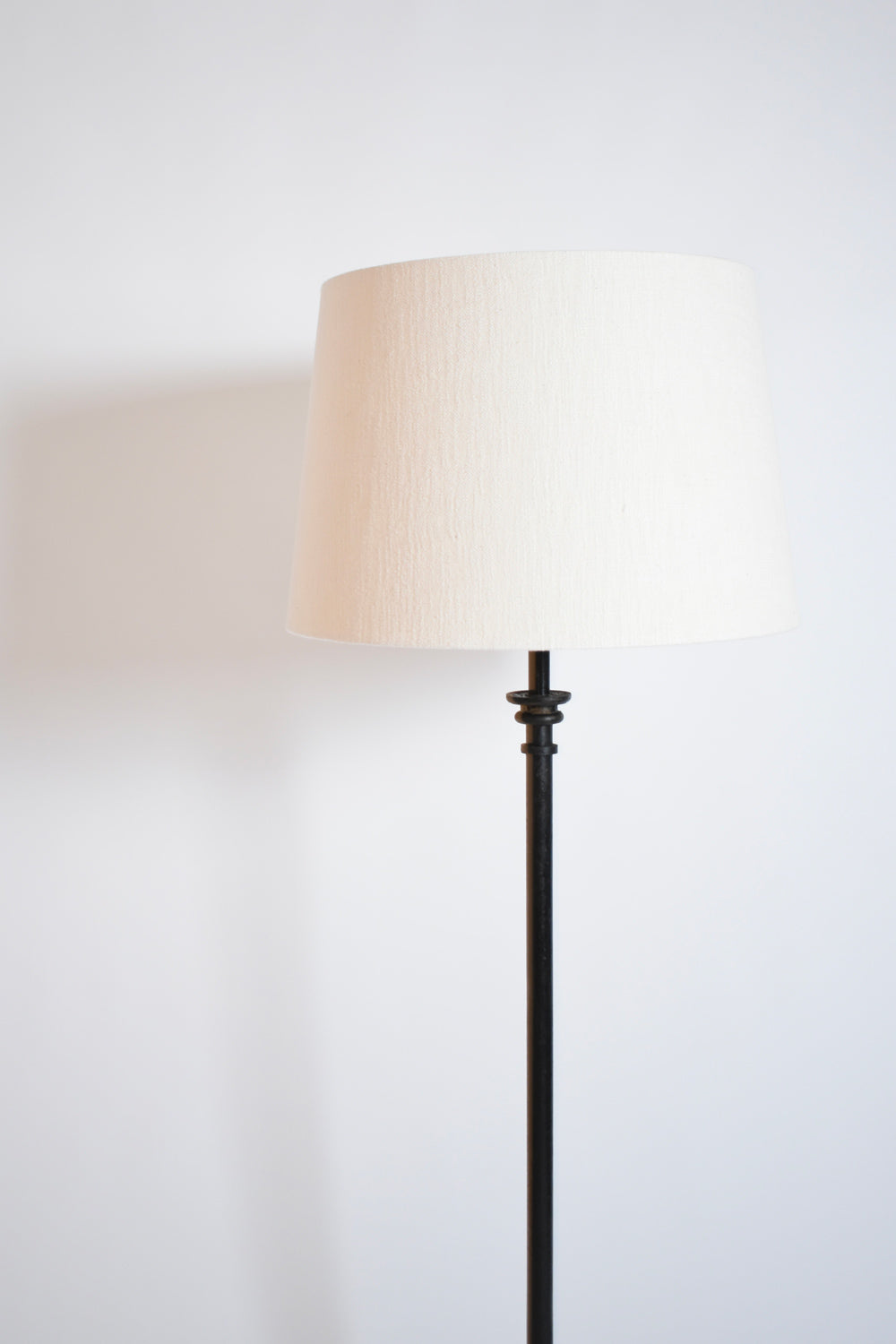Tripod wrought iron floor lamp, 1950s.