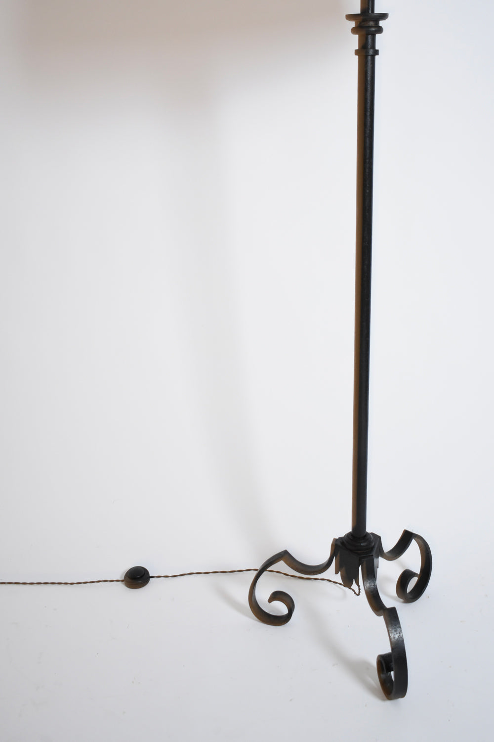 Tripod wrought iron floor lamp, 1950s.
