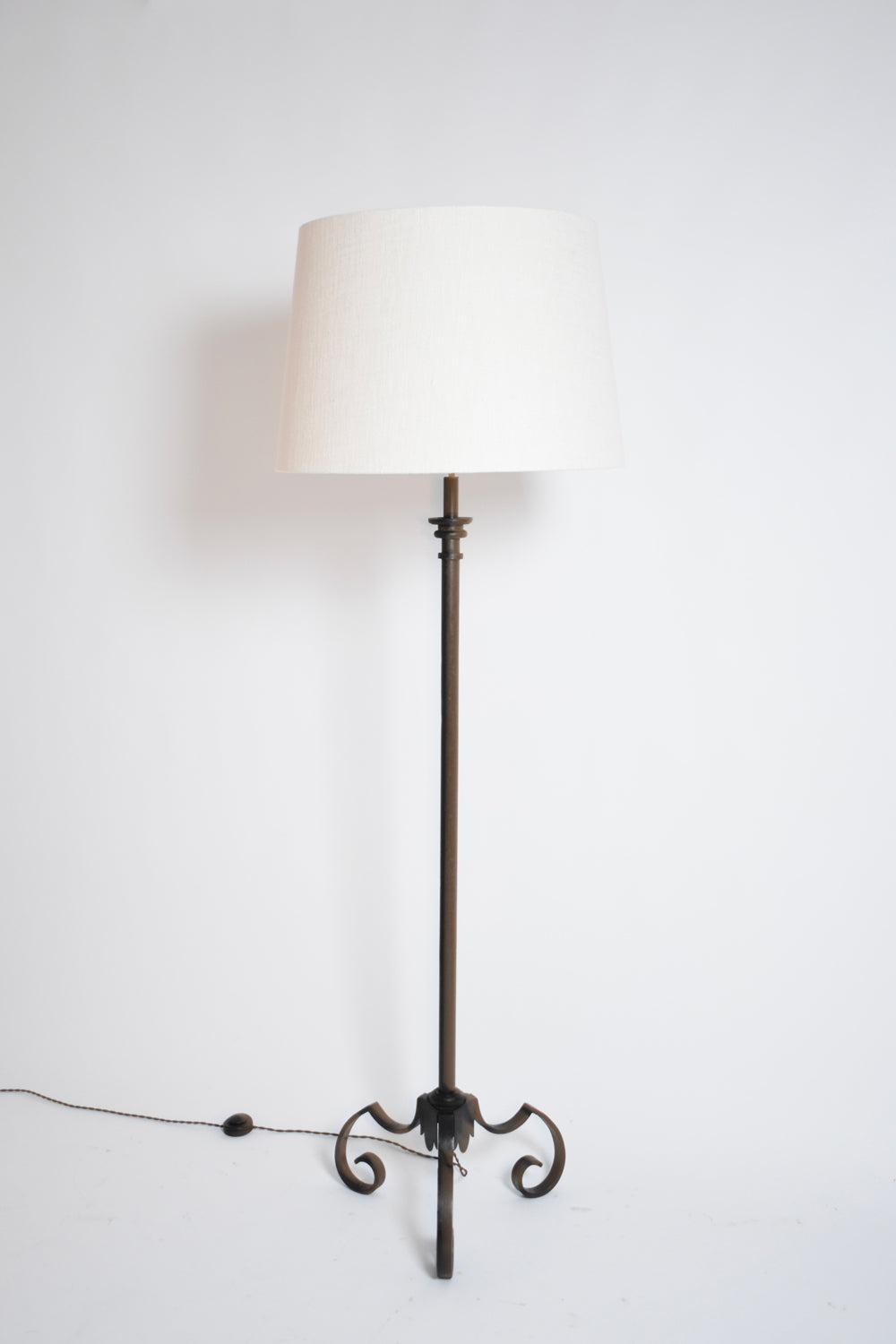 Tripod wrought iron floor lamp, 1950s.