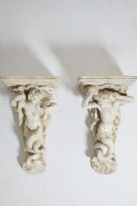 Pair of patinated ceramic wall console tables, 1940s.
