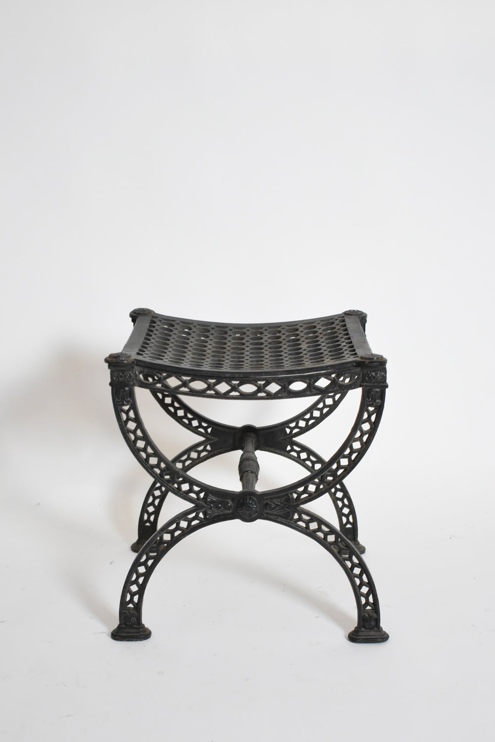 Pair of cast iron curule stools, 1970s.