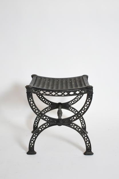 Pair of cast iron curule stools, 1970s.