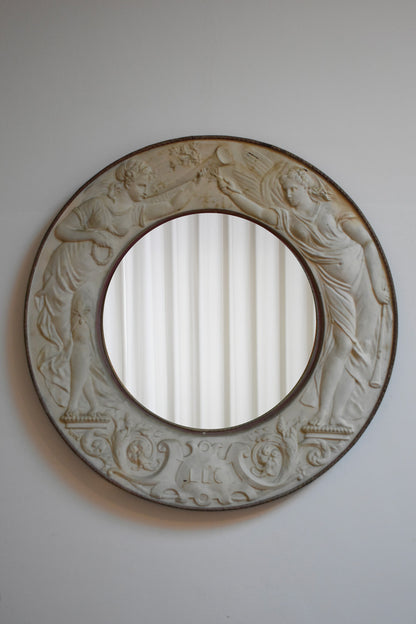 Important round embossed metal sheet mirror, 1910s.