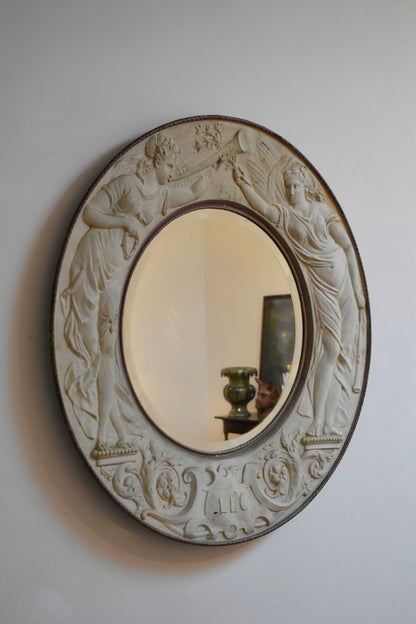 Important round embossed metal sheet mirror, 1910s.