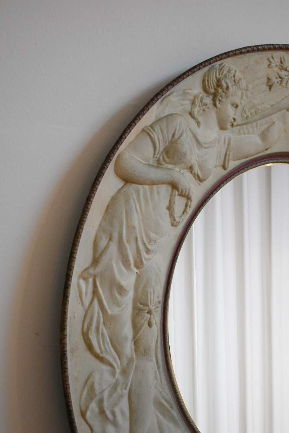 Important round embossed metal sheet mirror, 1910s.