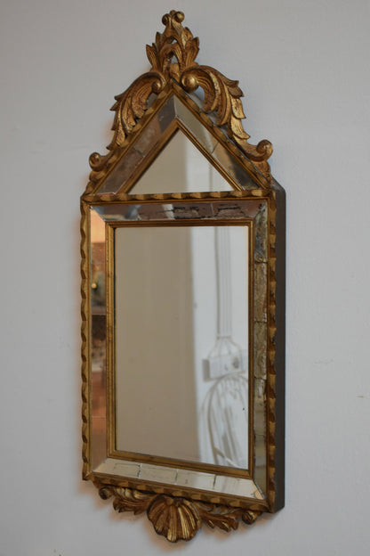 Set of four Pierre Dariel acanthus pediment mirrors, 1940s.