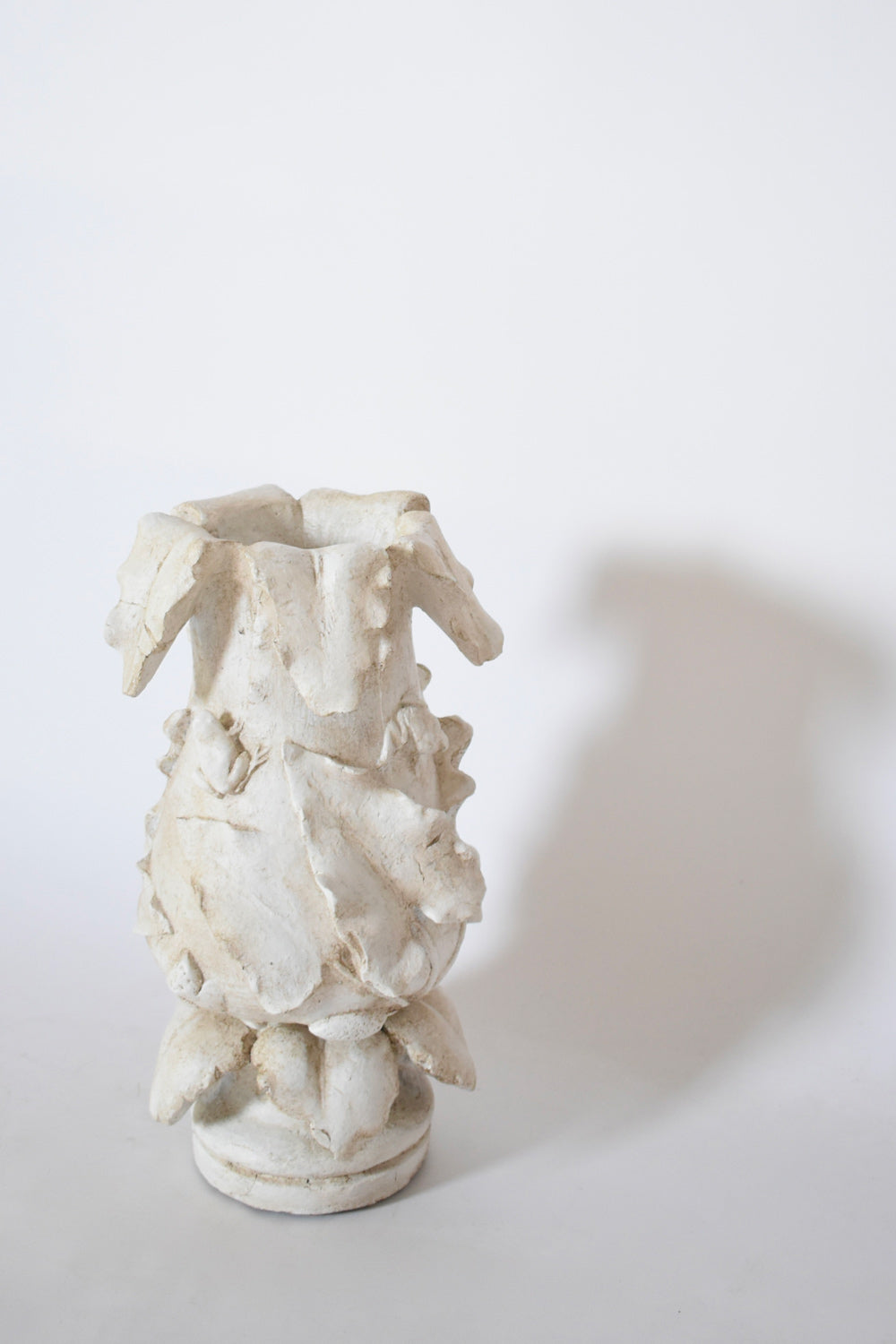 Plaster vase with floral pattern, 1920s.