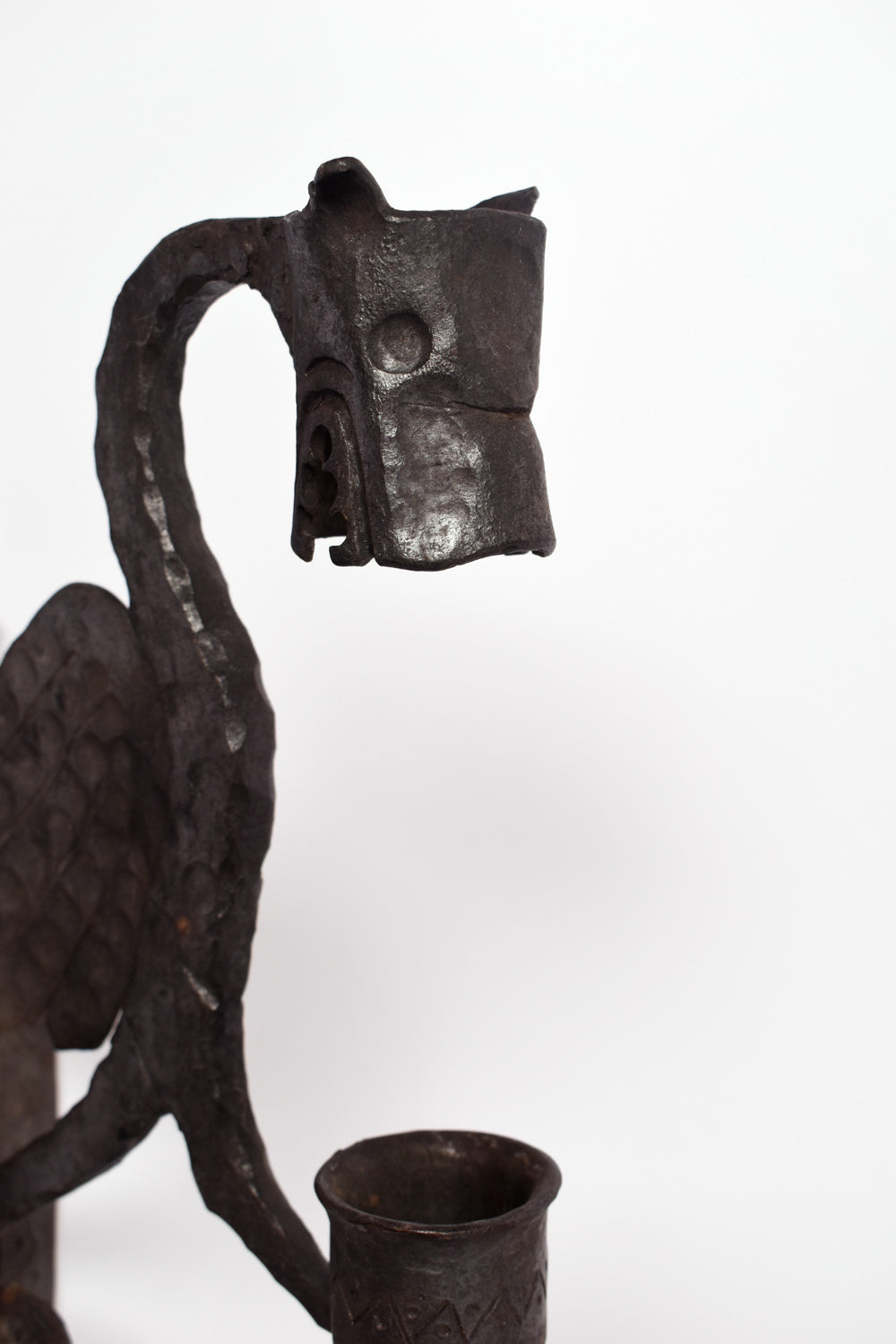 Pair of zoomorphic hammered iron mural candle holders representing dragons. France, 1960s.