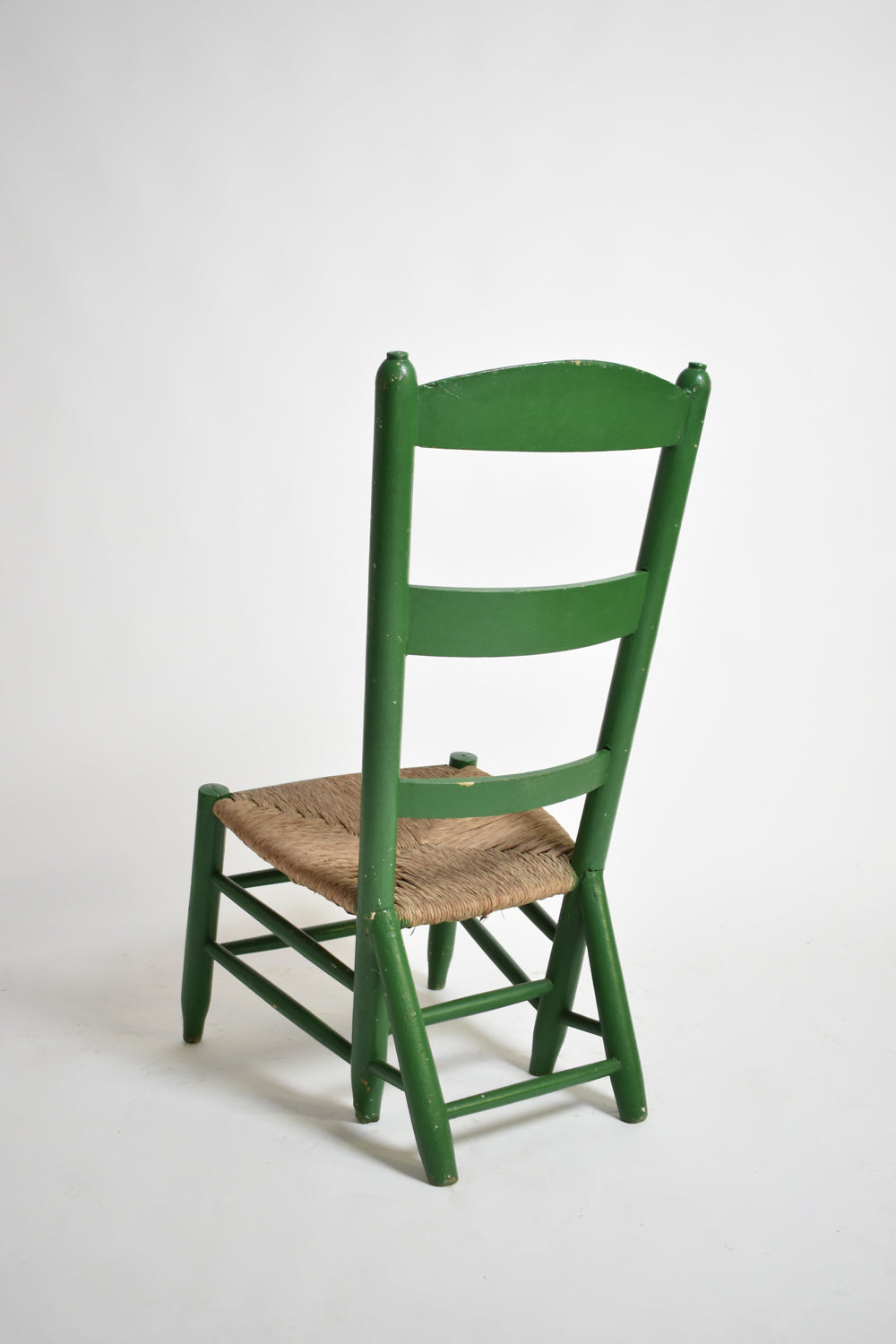 Green painted wood and straw fireside chair, 1960s.