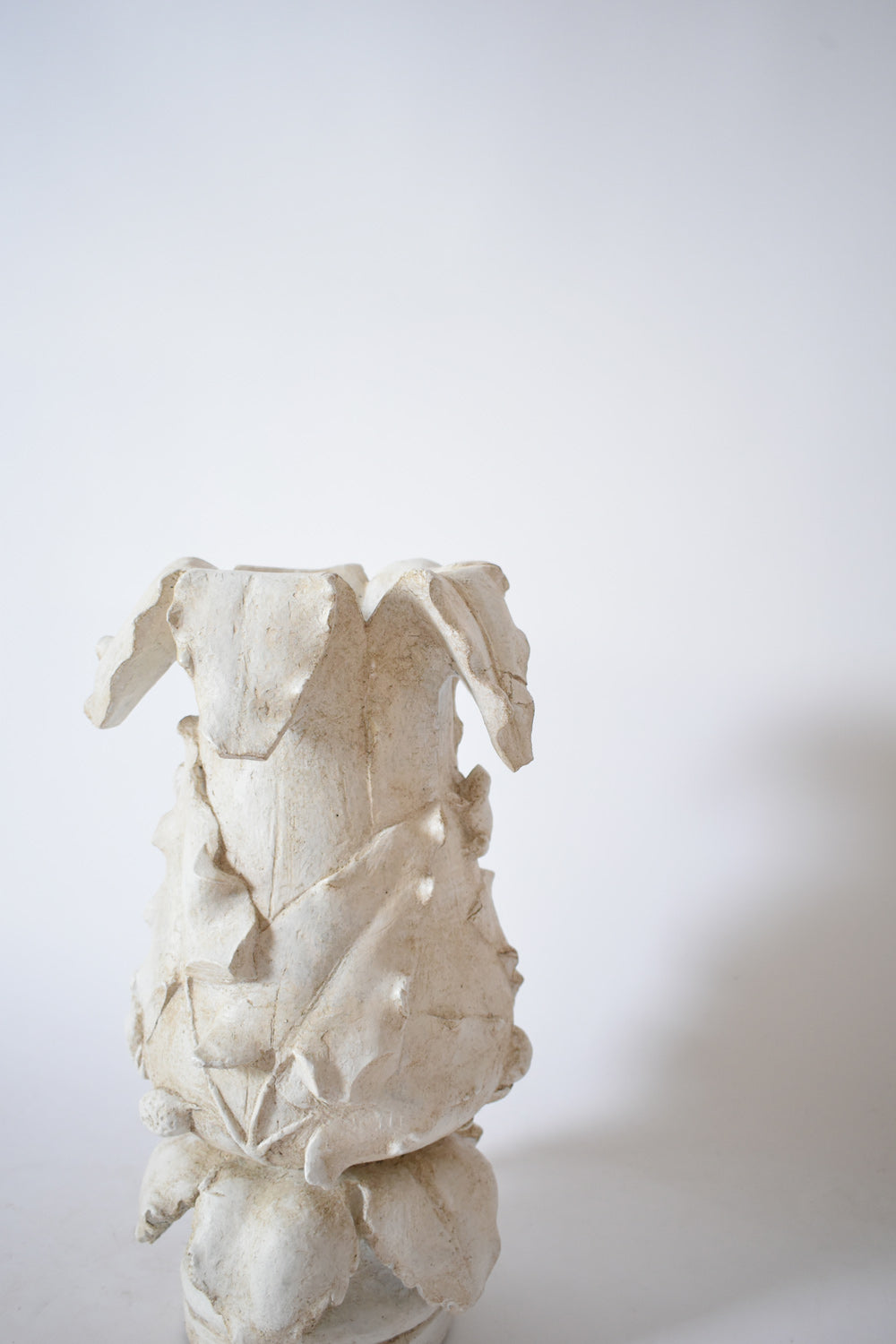 Plaster vase with floral pattern, 1920s.