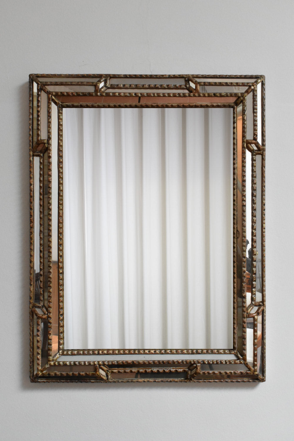 Giltwood and patinated-wood mirror, 1940s.