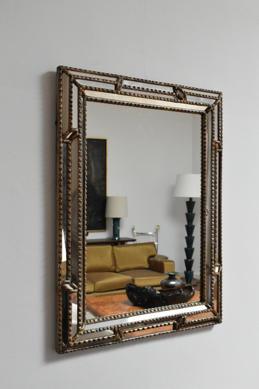 Giltwood and patinated-wood mirror, 1940s.