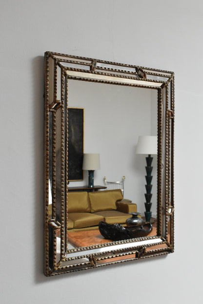 Giltwood and patinated-wood mirror, 1940s.