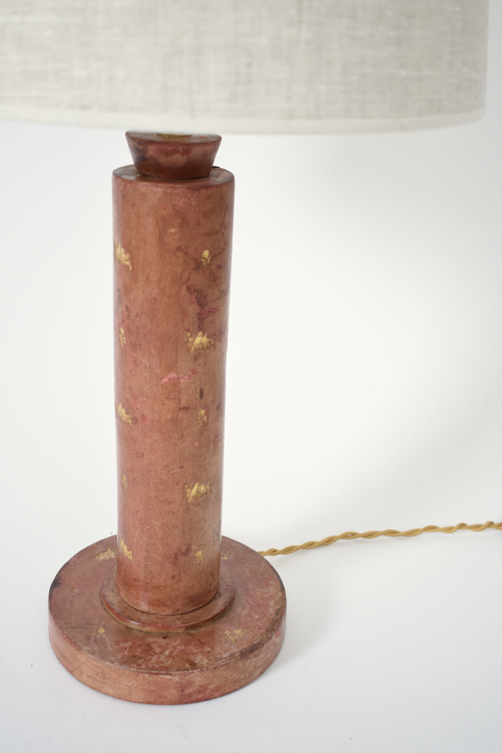 Cylindrical red leather covered lamp, 1940s.